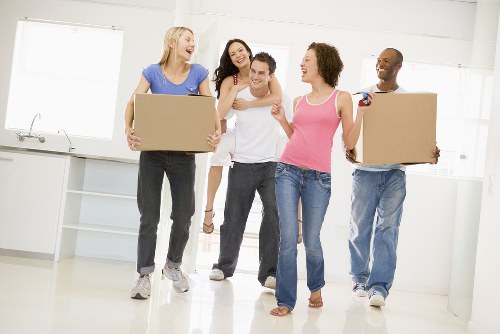 Team members following safe moving procedures during a removal job