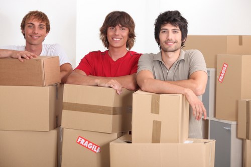 Local office removals team handling furniture and boxes in Highbury