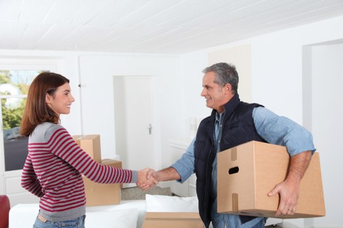 Office relocation items being handled by a removals team in Highbury