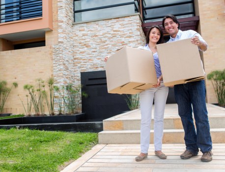 Professional movers loading household items for a Highbury flat removal
