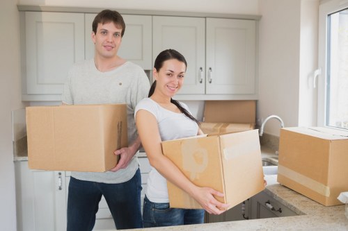 Organised unpacking of boxes in a Highbury flat after moving day